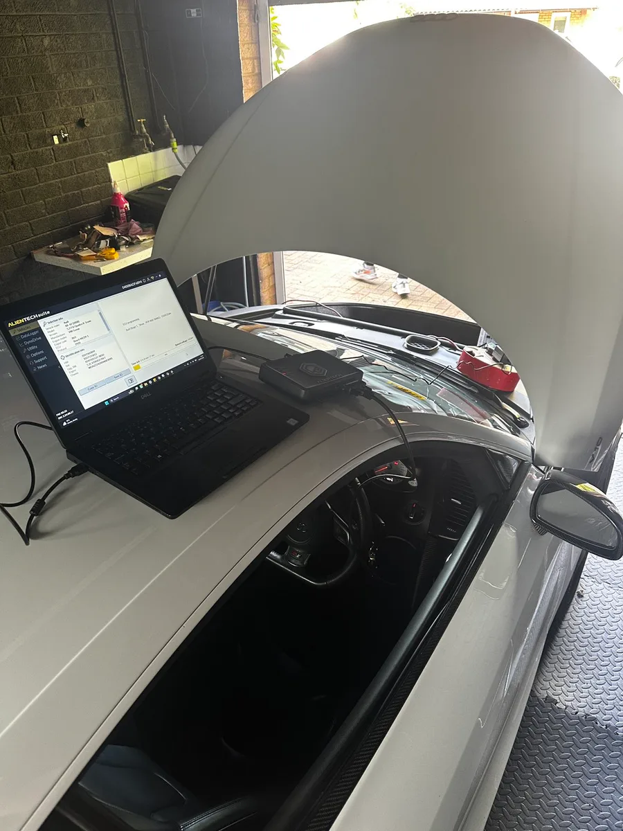 Laptop connected during vehicle software and diagnostic checks on an Audi R8